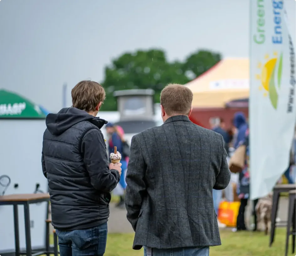 Two visitors at an early Greenscape stand at an outdoor county show