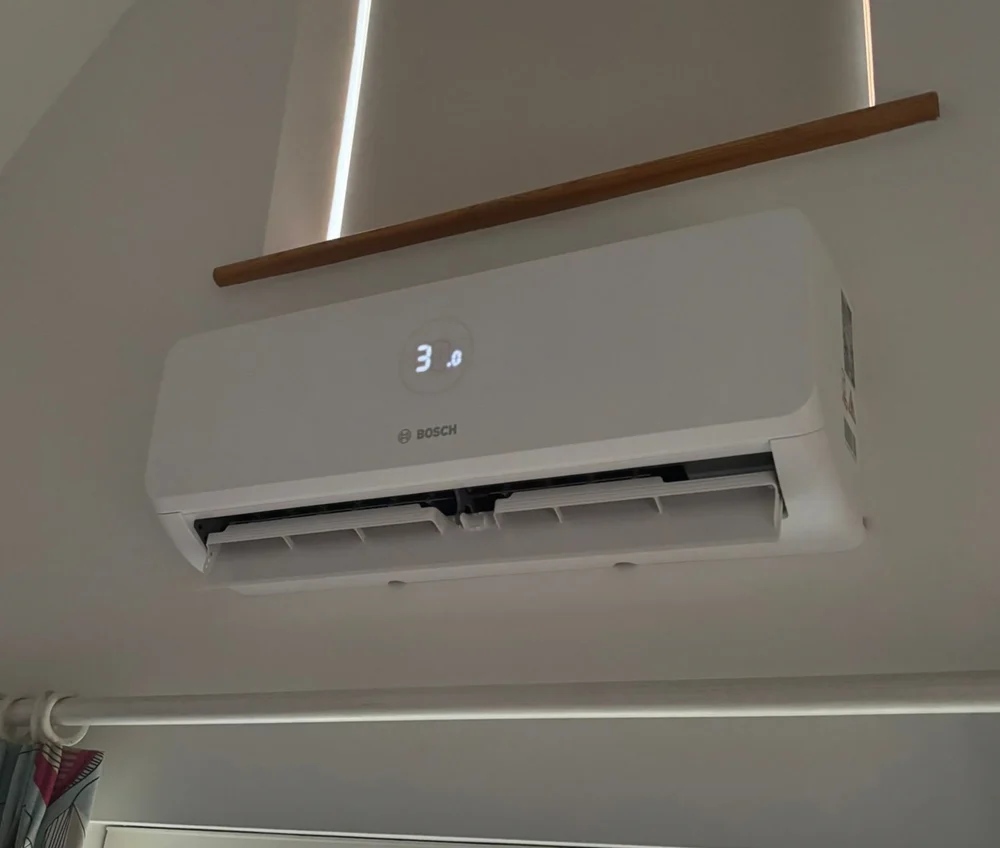 A Bosch indoor wall unit mounted high on a wall