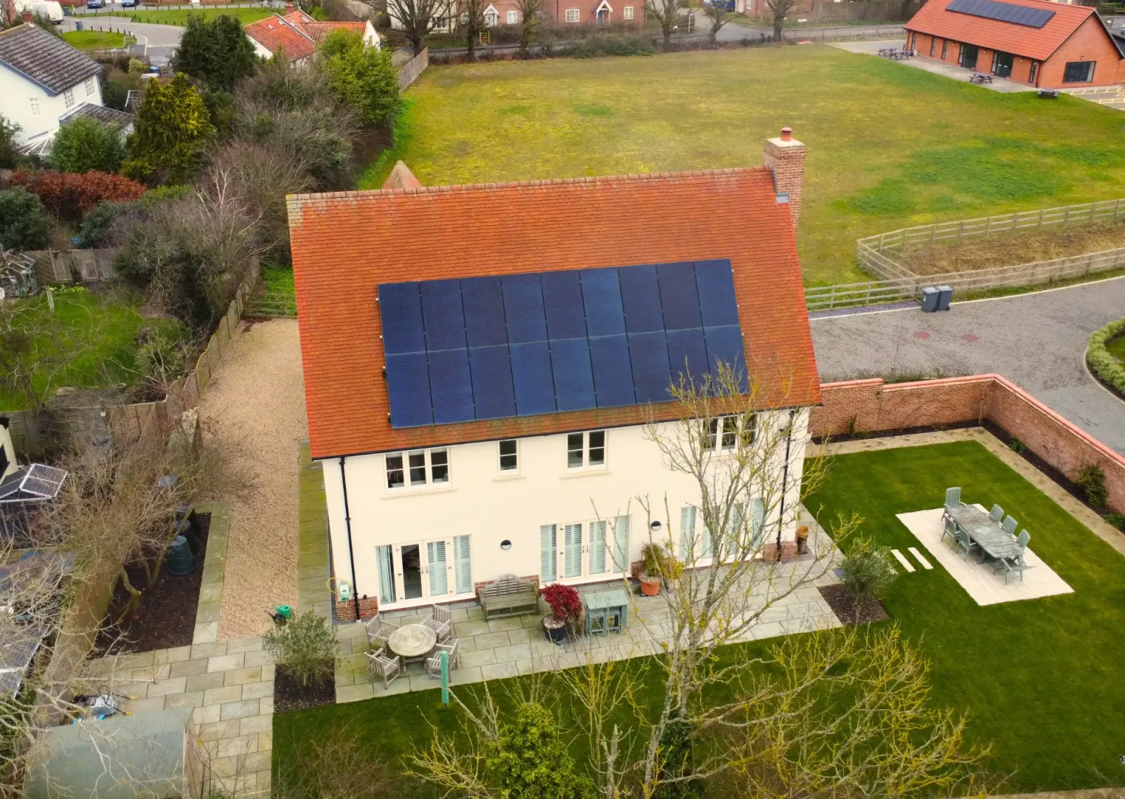Aerial view of the Malins' new-build home with a full roof of black solar panels