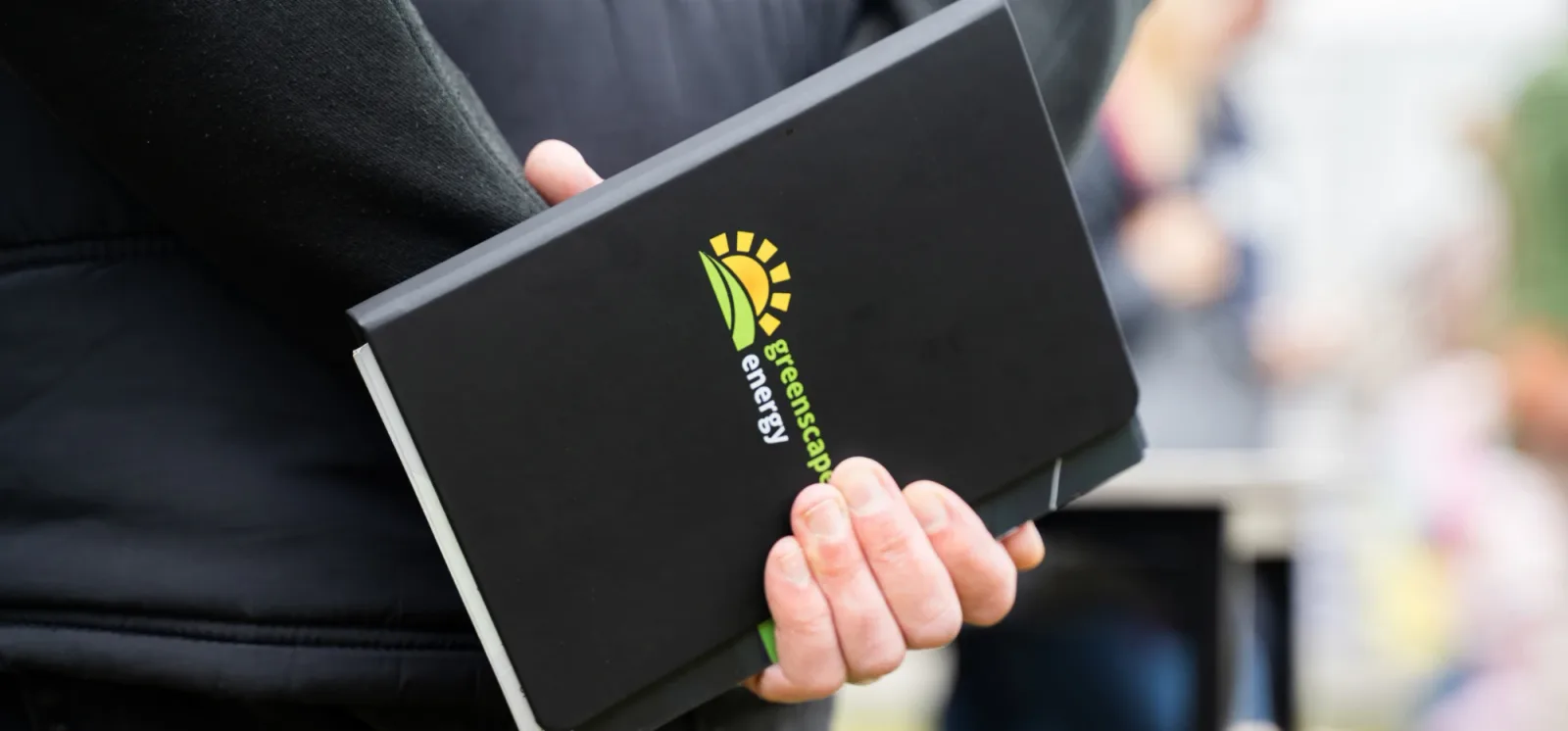 Handover paperwork and monitoring app being walked through with a customer