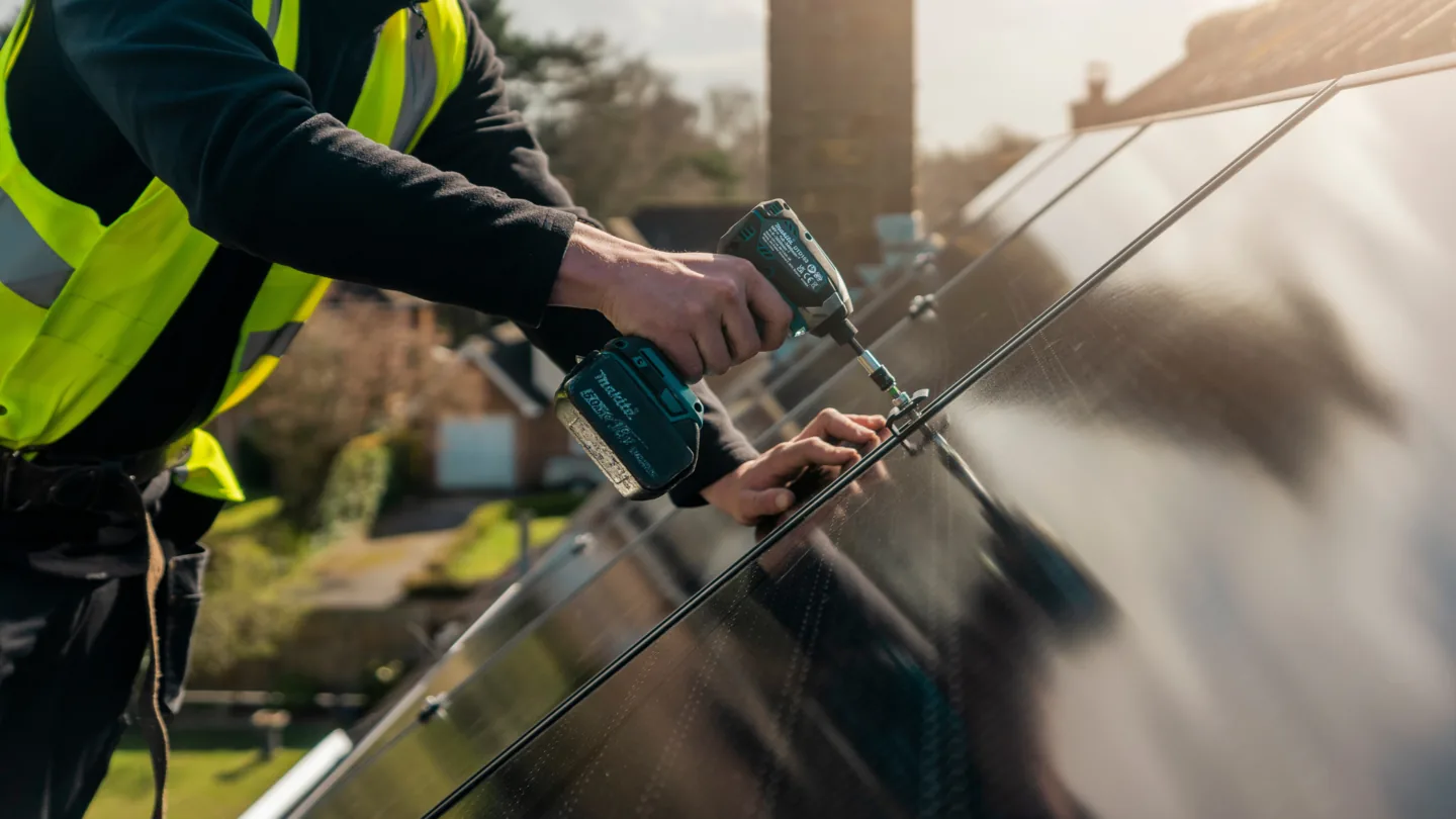 Greenscape fitters installing equipment at a customer's home