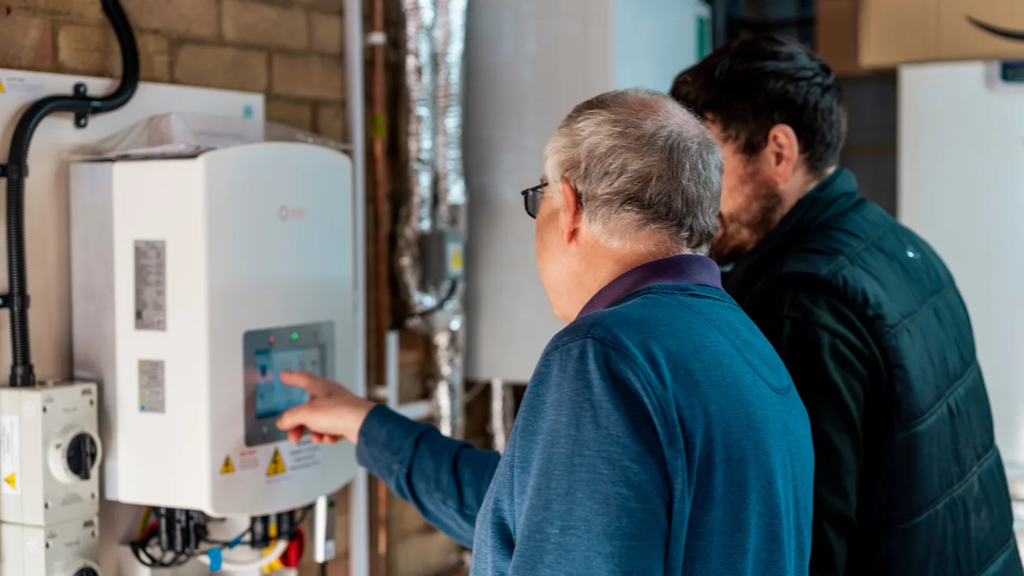 A homeowner checking their energy savings