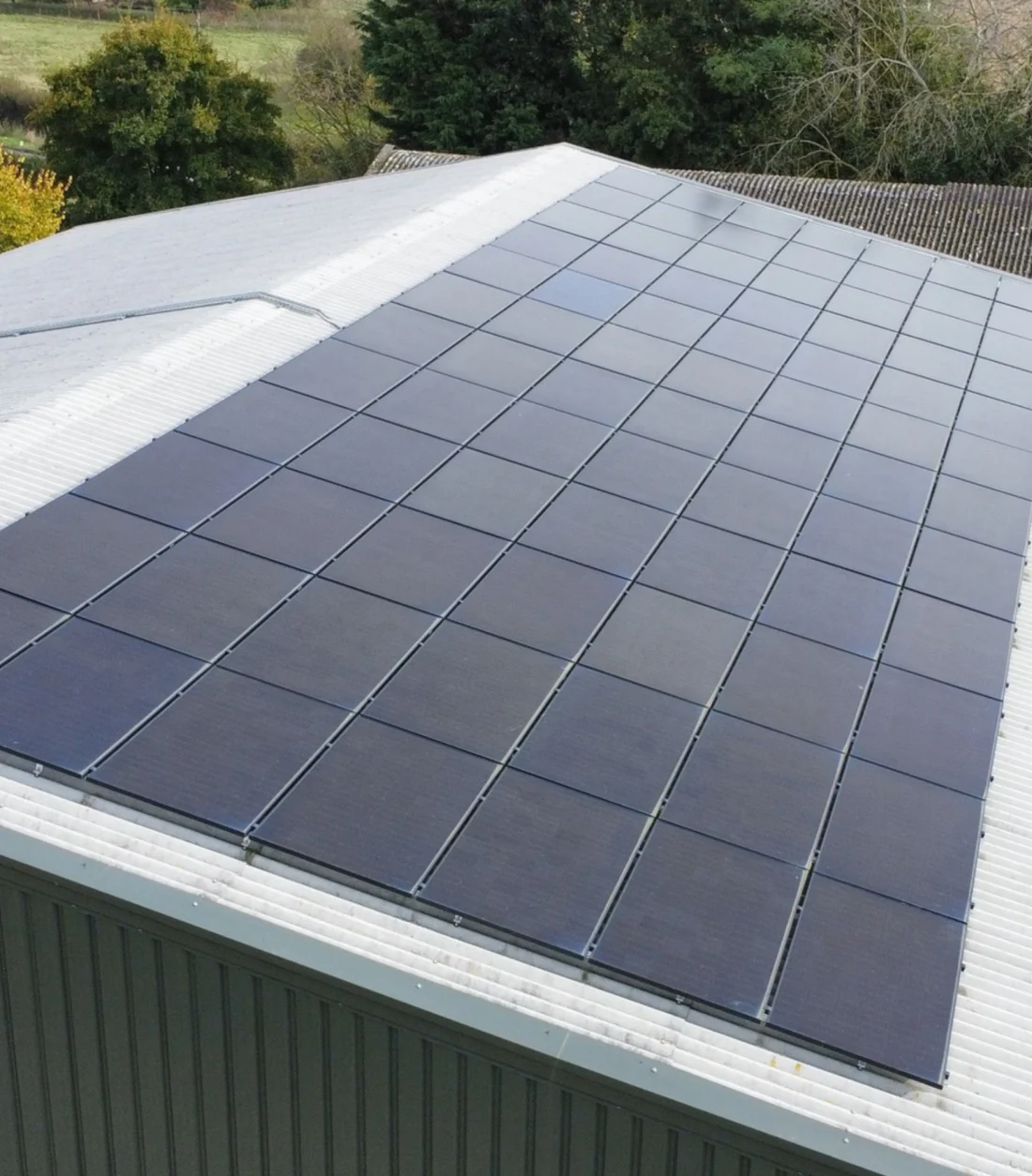 Black solar panels on a corrugated commercial roof